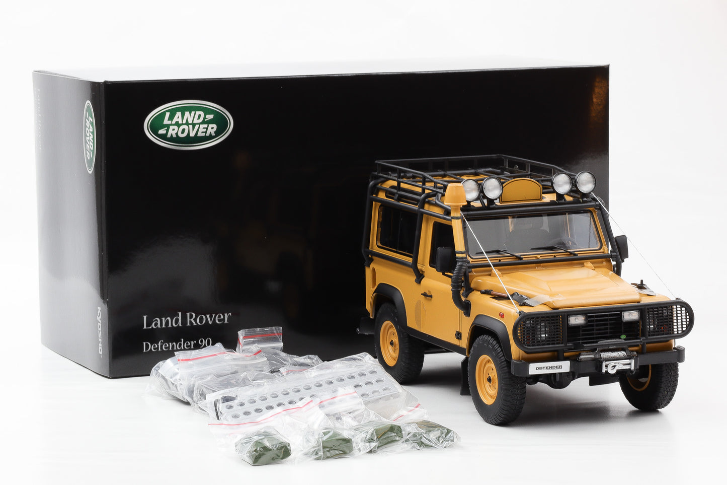 1:18 Kyosho Land Rover Defender 90 gelb mit Zubehör / ohne Camel 08901CT